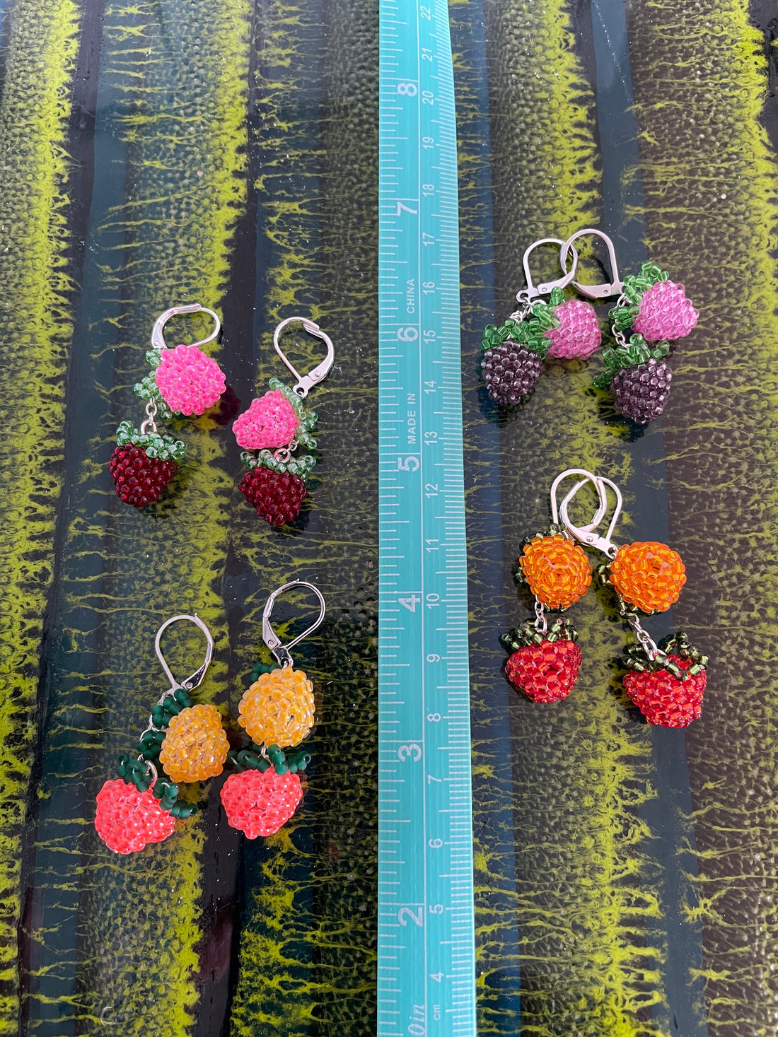 Double beaded salmonberry earrings- black light reactive!
